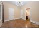 This neutral bedroom has access to a bathroom and closet through white doors at 7029 Pebble Bay Dr, Denver, NC 28037