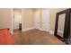 A bedroom has two doors and a full length mirror for functionality at 7029 Pebble Bay Dr, Denver, NC 28037