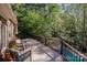 Relax on this home's back deck overlooking a private wooded backyard at 7029 Pebble Bay Dr, Denver, NC 28037