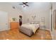 Bright bedroom with hardwood floors, ceiling fan, and neutral paint at 7029 Pebble Bay Dr, Denver, NC 28037