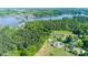 Expansive aerial view showcasing the community's lakefront homes and surrounding lush greenery, conveying serenity at 796 Cornelius Rd, Mooresville, NC 28117