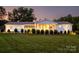 Well-manicured lawn and landscape of a single-story home with a covered entrance at dusk at 796 Cornelius Rd, Mooresville, NC 28117
