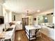 Well-lit kitchen with a center island, stainless steel appliances, and white cabinets at 796 Cornelius Rd, Mooresville, NC 28117