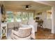 Sunlit sitting room with hardwood floors, a comfortable sofa, and bright natural light at 796 Cornelius Rd, Mooresville, NC 28117