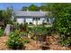 Barn with a garage door and beautiful landscaping at 796 Cornelius Rd, Mooresville, NC 28117
