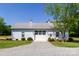 A modern farm outbuilding/garage featuring a metal roof, concrete driveway and ample parking at 796 Cornelius Rd, Mooresville, NC 28117
