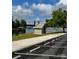 View of the lake with nearby parking and bath house at 796 Cornelius Rd, Mooresville, NC 28117