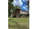 View of the backyard with mature trees and landscaping plus a pool at 809 23Rd E St, Newton, NC 28658