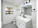 This remodeled bathroom features a large mirror, and a tiled shower at 809 23Rd E St, Newton, NC 28658