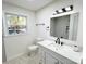 Updated bathroom with quartz counters, matte black fixtures, and a bright window at 809 23Rd E St, Newton, NC 28658