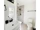 Updated bathroom featuring a modern vanity, black fixtures, and tiled shower at 809 23Rd E St, Newton, NC 28658