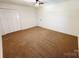 Bedroom featuring neutral carpet, ceiling fan, and ample closet space at 809 23Rd E St, Newton, NC 28658