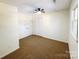 Bedroom with ceiling fan, natural light, neutral carpet, and closet at 809 23Rd E St, Newton, NC 28658