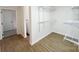 This closet is a walk-in with new laminate floors and white wire shelving at 809 23Rd E St, Newton, NC 28658