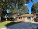 Attractive home exterior featuring a manicured lawn, concrete driveway and mature trees providing ample shade at 809 23Rd E St, Newton, NC 28658