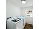 The bright laundry room is updated with new appliances and new laminate floors at 809 23Rd E St, Newton, NC 28658