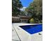 Backyard pool featuring blue water and a white pool deck, enhanced by an enclosed fence at 809 23Rd E St, Newton, NC 28658