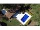 Overhead shot showcasing the pool, deck, and backyard of the home surrounded by manicured landscaping at 809 23Rd E St, Newton, NC 28658