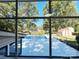 Interior view showcasing backyard pool and green landscape through a large window at 809 23Rd E St, Newton, NC 28658