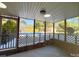 View from the screened porch to the in-ground pool and wooded backyard at 809 23Rd E St, Newton, NC 28658