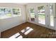 Sunroom with hardwood floors, great lighting, and direct access to the backyard at 809 23Rd E St, Newton, NC 28658