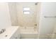 Upgraded bathroom features marble tile, new vanity, and modern, clean design at 125 S Ervin Ave, Newton, NC 28658