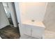 Modern bathroom featuring vanity with white cabinets and contemporary fixtures at 125 S Ervin Ave, Newton, NC 28658
