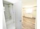 New bathroom and white kitchen renovations with marble tile in an updated home at 125 S Ervin Ave, Newton, NC 28658