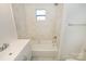 Bright bathroom with marble tile, updated fixtures, and clean, modern design at 125 S Ervin Ave, Newton, NC 28658