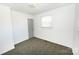 Bright bedroom featuring a neutral carpet, and one window at 125 S Ervin Ave, Newton, NC 28658