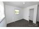 Bright bedroom with ample natural light, neutral carpet, and a classic light fixture at 125 S Ervin Ave, Newton, NC 28658