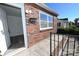 Exterior view of a brick home with front railing and natural light shining into interior space at 125 S Ervin Ave, Newton, NC 28658