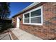 Close-up showcasing the brick detail and the entrance with a black railing at 125 S Ervin Ave, Newton, NC 28658