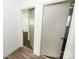 Hallway with neutral carpet and gray doors at 125 S Ervin Ave, Newton, NC 28658