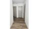 Hallway with two gray doors and vinyl flooring at 125 S Ervin Ave, Newton, NC 28658