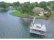 Stunning waterfront home with a private dock and lush landscaping at 18212 Pompano Pl, Cornelius, NC 28031