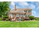 Beautiful home with a spacious backyard, patio area, lush lawn, and scenic view at 18212 Pompano Pl, Cornelius, NC 28031