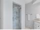 The renovated bathroom includes a glass shower stall and stylish fixtures at 18212 Pompano Pl, Cornelius, NC 28031