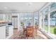 Bright dining room with bay windows offering beautiful lake view at 18212 Pompano Pl, Cornelius, NC 28031