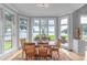Dining room with water view, set for six, with hardwood floors at 18212 Pompano Pl, Cornelius, NC 28031