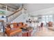 Open concept living room with kitchen and dining area featuring a staircase at 18212 Pompano Pl, Cornelius, NC 28031