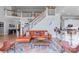 Spacious living room features a staircase and open concept kitchen at 18212 Pompano Pl, Cornelius, NC 28031