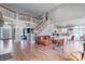 Spacious living room featuring a staircase, open concept kitchen and view at 18212 Pompano Pl, Cornelius, NC 28031