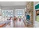 Bright living room with stone fireplace, hardwood floors and lake view at 18212 Pompano Pl, Cornelius, NC 28031