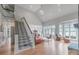 Open living room with high ceilings, lake views, and fireplace at 18212 Pompano Pl, Cornelius, NC 28031