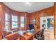 Office with wood paneling, and a large bay window at 18212 Pompano Pl, Cornelius, NC 28031