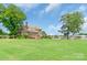 Beautifully landscaped yard leading to the waterfront, providing ample space for outdoor activities at 18212 Pompano Pl, Cornelius, NC 28031