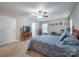 Comfortable bedroom featuring a ceiling fan, dresser, and art display at 5039 Penn Rd, Iron Station, NC 28080