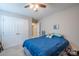 Comfortable bedroom featuring a ceiling fan, closet, and picture frame at 5039 Penn Rd, Iron Station, NC 28080