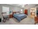 Spacious bedroom featuring a ceiling fan, two dressers, and two nightstands at 5039 Penn Rd, Iron Station, NC 28080